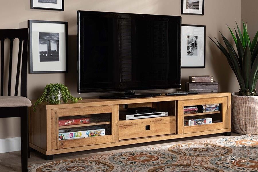The appearance of Baxton Studio Beasley Modern and Contemporary Oak Brown Finished Wood 1-Drawer TV Stand designed by Baxton Studio in the modern / contemporary interior design. This oak brown piece of furniture  was selected by 1StopBedrooms from Beasley Collection to add a touch of cosiness and style into your home. Sku: TV834180-Wotan Oak. Product Type: TV Stand. Material: MDF. Image1