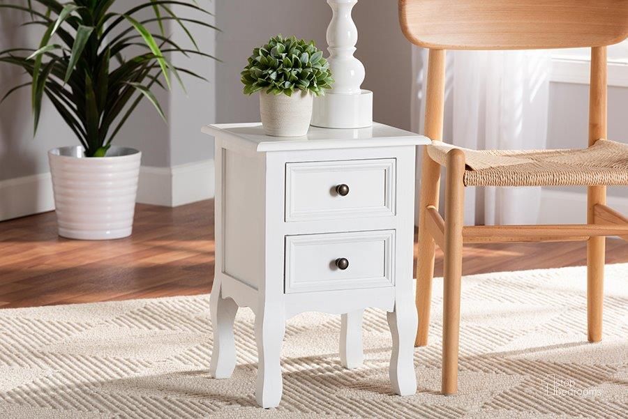 The appearance of Baxton Studio Caelan Classic and Traditional White Finished Wood 2-Drawer Nightstand designed by Baxton Studio in the traditional interior design. This white and black piece of furniture  was selected by 1StopBedrooms from Caelan Collection to add a touch of cosiness and style into your home. Sku: FZC020117-White-NS. Material: Wood. Product Type: Nightstand. Image1