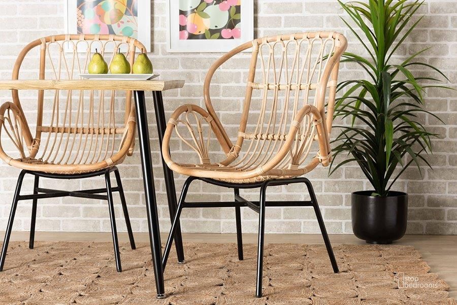 The appearance of Baxton Studio Caelia Modern Bohemian Natural Brown Rattan And Black Metal Chair designed by Baxton Studio in the coastal interior design. This natural brown piece of furniture  was selected by 1StopBedrooms from Caelia Collection to add a touch of cosiness and style into your home. Sku: RMC033-Rattan-DC. Product Type: Dining Chair. Material: Rattan. Image1