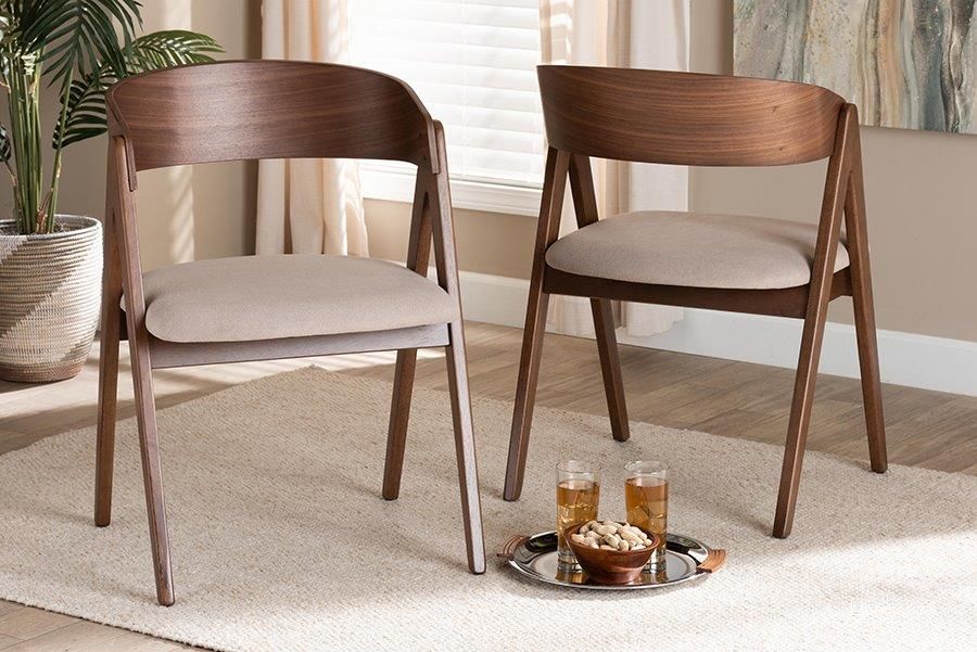 The appearance of Baxton Studio Danton Mid-Century Modern Beige Fabric Upholstered and Walnut Brown Finished Wood 2-Piece Dining Chair Set designed by Baxton Studio in the transitional interior design. This walnut and beige piece of furniture  was selected by 1StopBedrooms from Danton Collection to add a touch of cosiness and style into your home. Sku: WM1900B-Latte/Walnut-DC. Product Type: Dining Chair. Material: Rubberwood. Image1