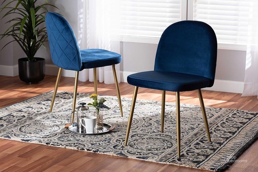 The appearance of Baxton Studio Fantine Modern Luxe and Glam Navy Blue Velvet Fabric Upholstered and Gold Finished Metal 2-Piece Dining Chair Set designed by Baxton Studio in the glam interior design. This blue and gold piece of furniture  was selected by 1StopBedrooms from Fantine Collection to add a touch of cosiness and style into your home. Sku: DC176-Navy Blue Velvet/Gold-DC. Material: Polyester. Product Type: Dining Chair. Image1