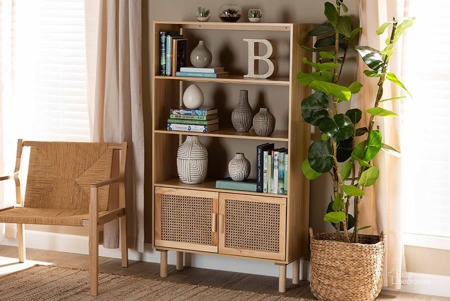 The appearance of Baxton Studio Faulkner Mid-Century Modern Natural Brown Finished Wood and Rattan 2-Door Bookcase designed by Baxton Studio in the transitional interior design. This beige and brown piece of furniture  was selected by 1StopBedrooms from Faulkner Collection to add a touch of cosiness and style into your home. Sku: FM203-034-Natural Wooden-Bookcase. Product Type: Bookcase. Material: MDF. Image1