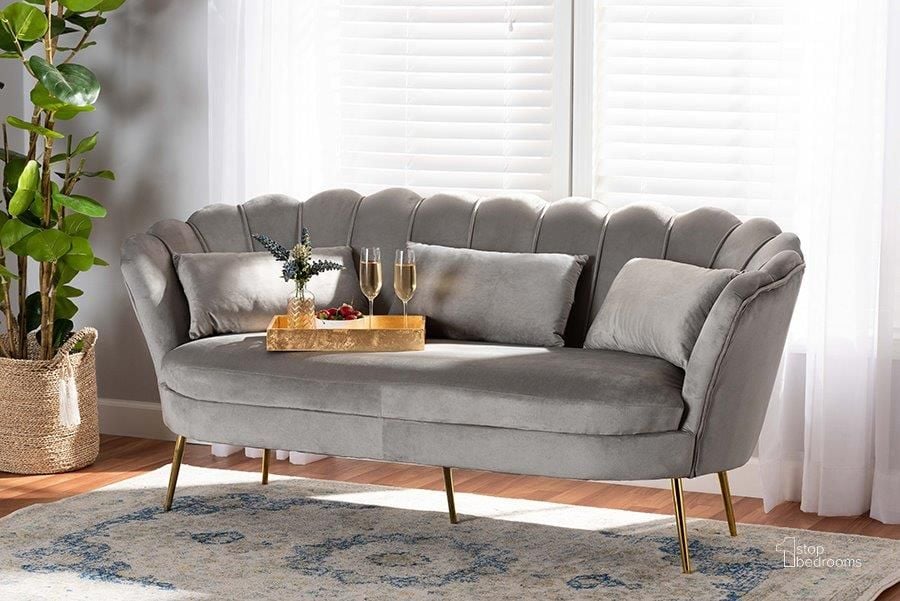 The appearance of Baxton Studio Genia Contemporary Glam and Luxe Grey Velvet Fabric Upholstered and Gold Metal Sofa designed by Baxton Studio in the glam interior design. This grey and gold piece of furniture  was selected by 1StopBedrooms from Genia Collection to add a touch of cosiness and style into your home. Sku: DC-02T-Shiny Velvet Light Grey-Sofa. Material: Polyester. Product Type: Sofa. Image1
