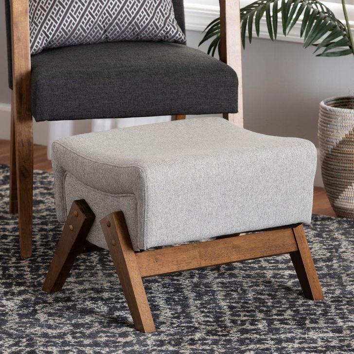 The appearance of Baxton Studio Hanson Mid-Century Modern Light Grey Fabric And Walnut Brown Finished Wood Ottoman designed by Baxton Studio in the transitional interior design. This light grey piece of furniture  was selected by 1StopBedrooms from Hanson Collection to add a touch of cosiness and style into your home. Sku: RAC527-Light Grey-Otto. Product Type: Ottoman. Material: MDF. Image1