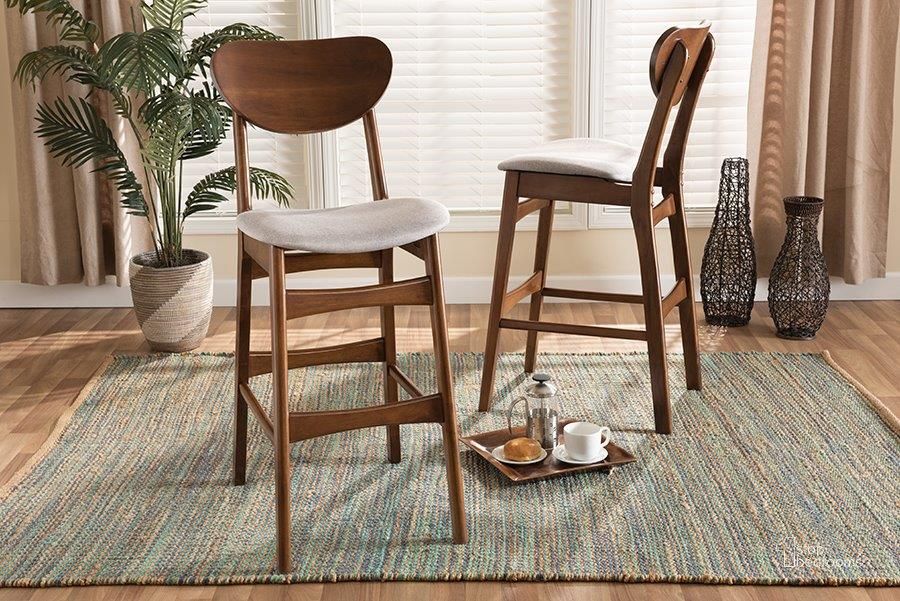 The appearance of Baxton Studio Katya Mid-Century Modern Grey Fabric Upholstered and Walnut Brown Finished Wood 2-Piece Bar Stool Set designed by Baxton Studio in the transitional interior design. This walnut brown piece of furniture  was selected by 1StopBedrooms from Katya Collection to add a touch of cosiness and style into your home. Sku: RH378BP-Grey/Walnut Bent Seat-BS-2PK. Product Type: Barstool. Material: Rubberwood. Image1