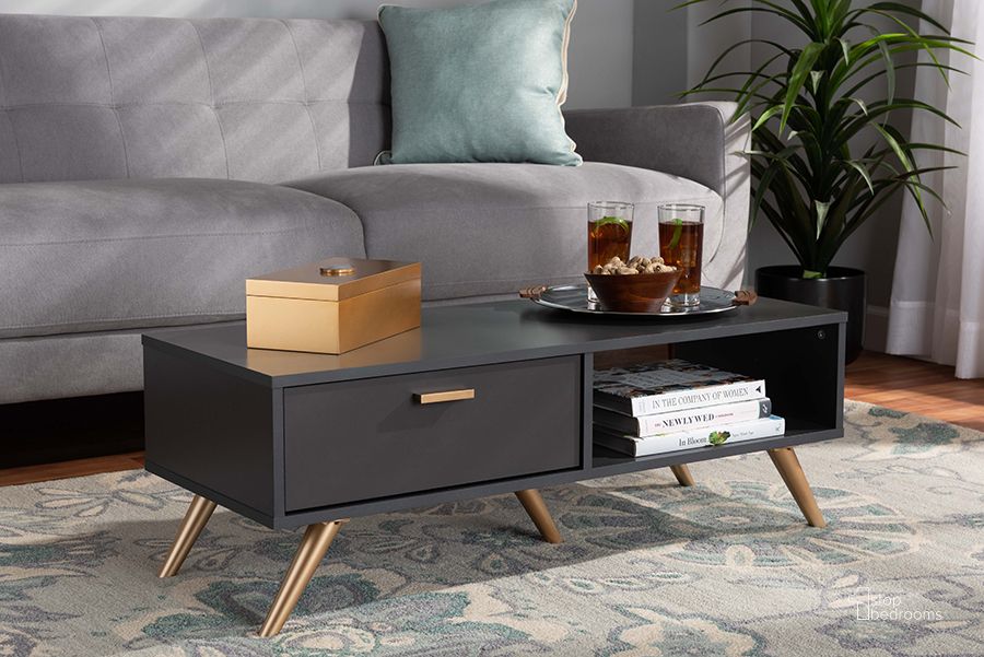 The appearance of Baxton Studio Kelson Modern And Contemporary Dark Grey And Gold Finished Wood Coffee Table designed by Baxton Studio in the modern / contemporary interior design. This dark grey piece of furniture  was selected by 1StopBedrooms from Kelson Collection to add a touch of cosiness and style into your home. Sku: LV19CFT1914-Dark Grey-CT. Product Type: Coffee Table. Material: MDF. Image1