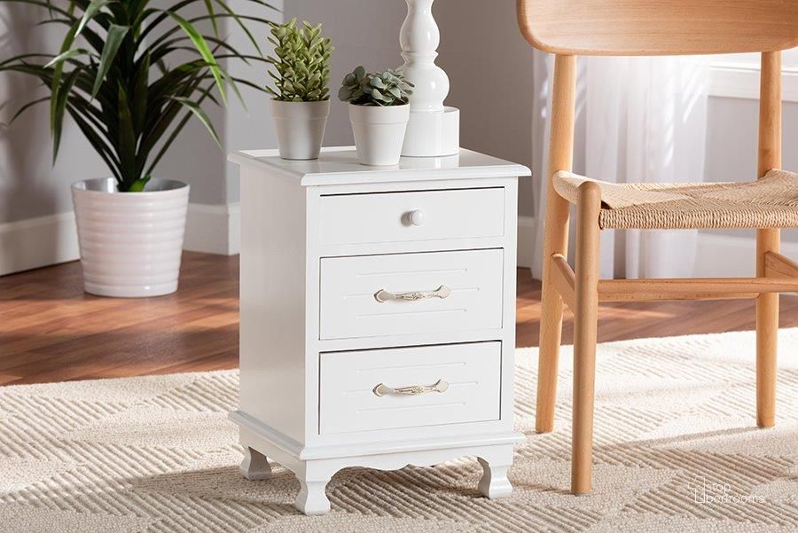 The appearance of Baxton Studio Layton Classic and Traditional White Finished Wood 3-Drawer Nightstand designed by Baxton Studio in the traditional interior design. This white piece of furniture  was selected by 1StopBedrooms from Layton Collection to add a touch of cosiness and style into your home. Sku: FZC180882-White Wooden-NS. Material: Wood. Product Type: Nightstand. Image1