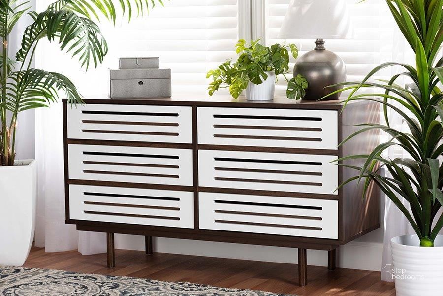 The appearance of Baxton Studio Meike Mid-Century Modern Two-Tone Walnut Brown and White Finished Wood 6-Drawer Dresser designed by Baxton Studio in the transitional interior design. This walnut and white piece of furniture  was selected by 1StopBedrooms from Meike Collection to add a touch of cosiness and style into your home. Sku: LV14COD14232WI-Columbia/White-6DW-Dresser. Material: Wood. Product Type: Dresser. Image1