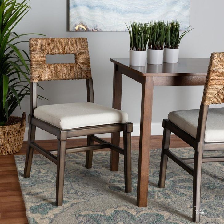 The appearance of Baxton Studio Porsha Modern Bohemian Dark Brown Finished Mahogany Wood And Natural Rattan Dining Chair designed by Baxton Studio in the coastal interior design. This natural brown piece of furniture  was selected by 1StopBedrooms from Porsha Collection to add a touch of cosiness and style into your home. Sku: Porsha-Mahogany-DC. Material: Wood. Product Type: Dining Chair. Image1