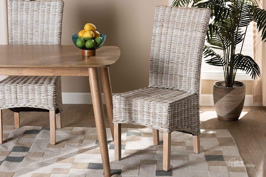 The appearance of Baxton Studio Trianna Rustic Transitional Whitewashed Rattan And Natural Brown Finished Wood Dining Chair designed by Baxton Studio in the transitional interior design. This white piece of furniture  was selected by 1StopBedrooms from Trianna Collection to add a touch of cosiness and style into your home. Sku: Florence Highback-White Washed-DC. Material: Wood. Product Type: Dining Chair. Image1