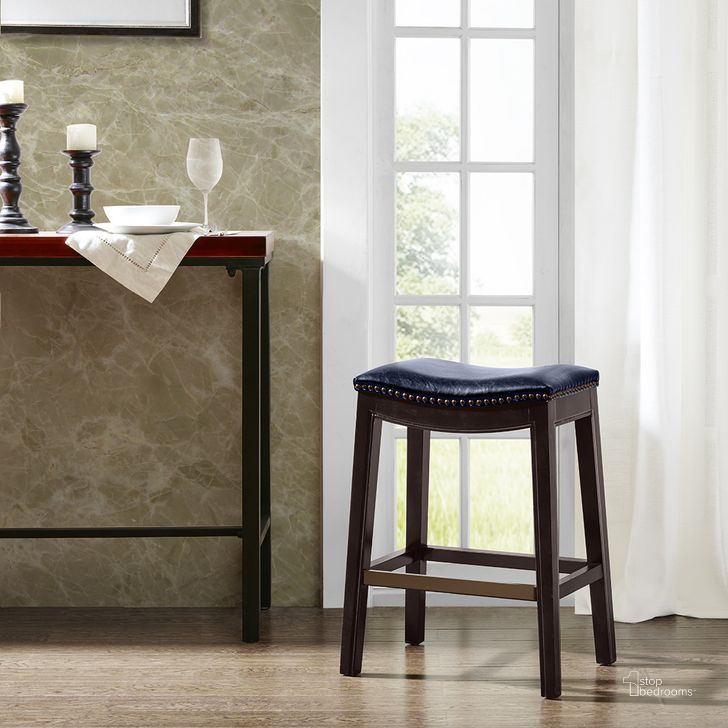 The appearance of Belfast Saddle Counter Stool In Navy designed by Olliix in the modern / contemporary interior design. This navy piece of furniture  was selected by 1StopBedrooms from Belfast Collection to add a touch of cosiness and style into your home. Sku: FUR101-0039. Material: Wood. Product Type: Barstool. Image1