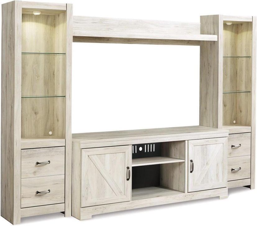 The appearance of Bellaby 4-Piece Entertainment Center designed by Signature Design by Ashley in the transitional interior design. This white wash piece of furniture  was selected by 1StopBedrooms from Bellaby Collection to add a touch of cosiness and style into your home. Sku: W331-24;W331-24;W331-27;W331-68. Material: Wood. Product Type: Entertainment Center. Image1