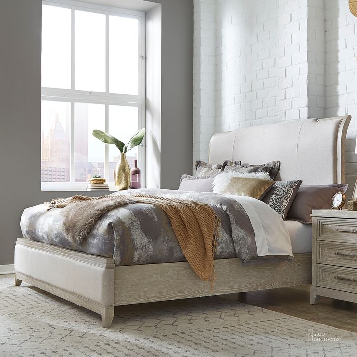 The appearance of Belmar California King Upholstered Bed designed by Liberty in the modern / contemporary interior design. This taupe piece of furniture  was selected by 1StopBedrooms from Belmar Collection to add a touch of cosiness and style into your home. Sku: 902-BR91C;902-BR22HU;902-BR16FU. Bed Size: California King. Product Type: Upholstered Bed. Material: Rubberwood. Image1