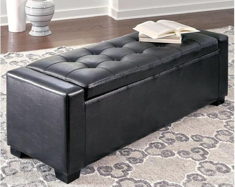 The appearance of Benches Black Upholstered Storage Bench designed by Signature Design by Ashley in the modern / contemporary interior design. This black piece of furniture  was selected by 1StopBedrooms from Benches Collection to add a touch of cosiness and style into your home. Sku: B010-209. Product Type: Storage Bench. Material: Leather Match. Image1