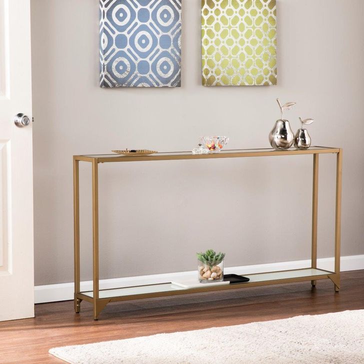 The appearance of Bergen Narrow Metal Console In Gold designed by SEI Furniture in the glam interior design. This gold piece of furniture  was selected by 1StopBedrooms from Bergen Collection to add a touch of cosiness and style into your home. Sku: CM1656. Material: Wood. Product Type: Console. Image1