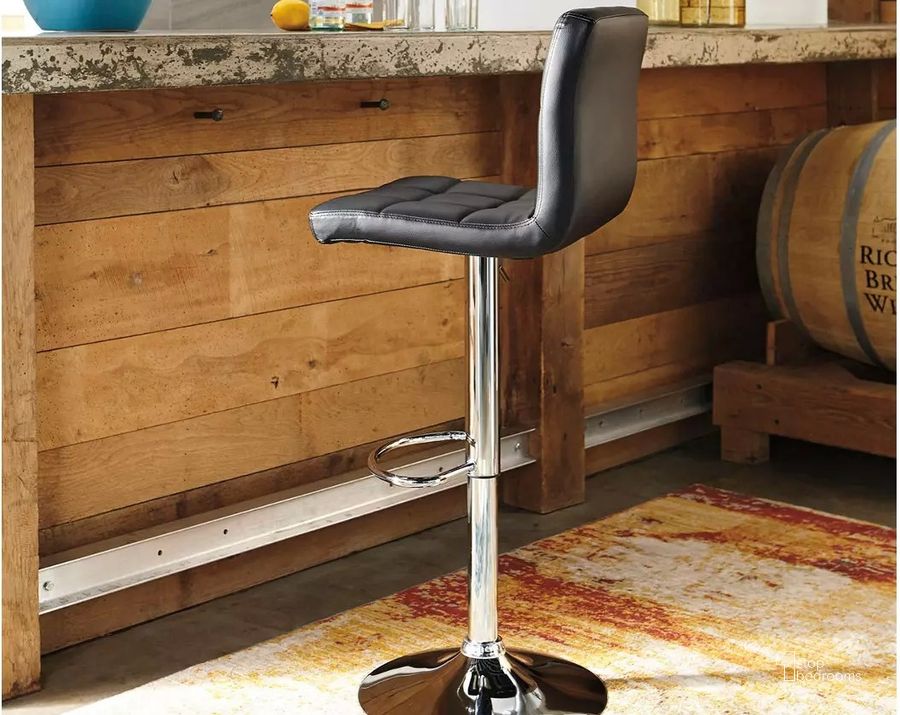 The appearance of Black and Chrome Tall Upholstered Swivel Barstool Set of 2 designed by Signature Design by Ashley in the modern / contemporary interior design. This black and chrome piece of furniture  was selected by 1StopBedrooms from Black Collection to add a touch of cosiness and style into your home. Sku: D120-130. Material: Leather Match. Product Type: Barstool. Image1