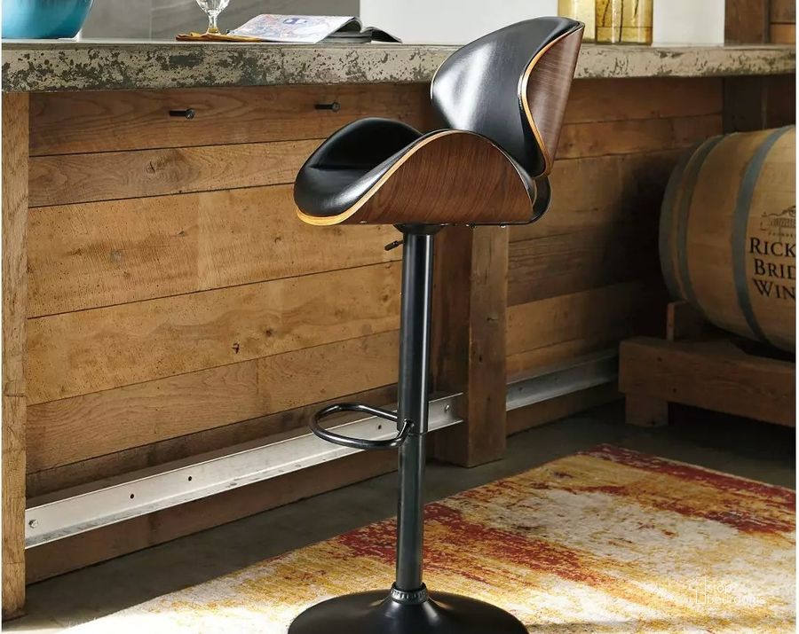 The appearance of Black Tall Upholstered Swivel Barstool designed by Signature Design by Ashley in the modern / contemporary interior design. This brown piece of furniture  was selected by 1StopBedrooms from Black Collection to add a touch of cosiness and style into your home. Sku: D120-530. Material: Leather Match. Product Type: Barstool. Image1