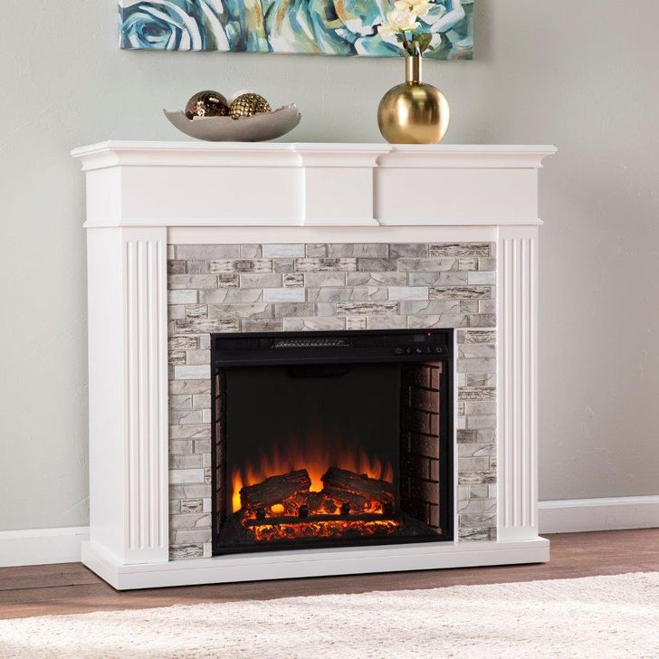 The appearance of Bondale Electric Fireplace With Faux Stone Surround designed by SEI Furniture in the transitional interior design. This white and gray piece of furniture  was selected by 1StopBedrooms from Bondale Collection to add a touch of cosiness and style into your home. Sku: FE1157059. Material: Wood. Product Type: Fireplace. Image1