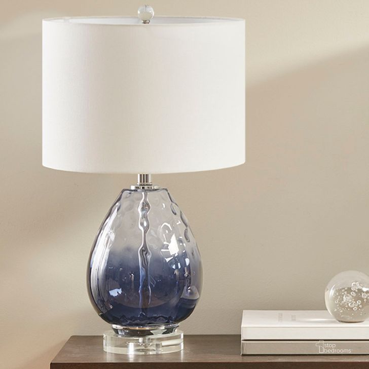 The appearance of Borel Glass Table Lamp In Dark Blue designed by Olliix in the transitional interior design. This dark blue piece of furniture  was selected by 1StopBedrooms from Borel Collection to add a touch of cosiness and style into your home. Sku: UH153-0099. Material: Polyester. Product Type: Table Lamp. Image1