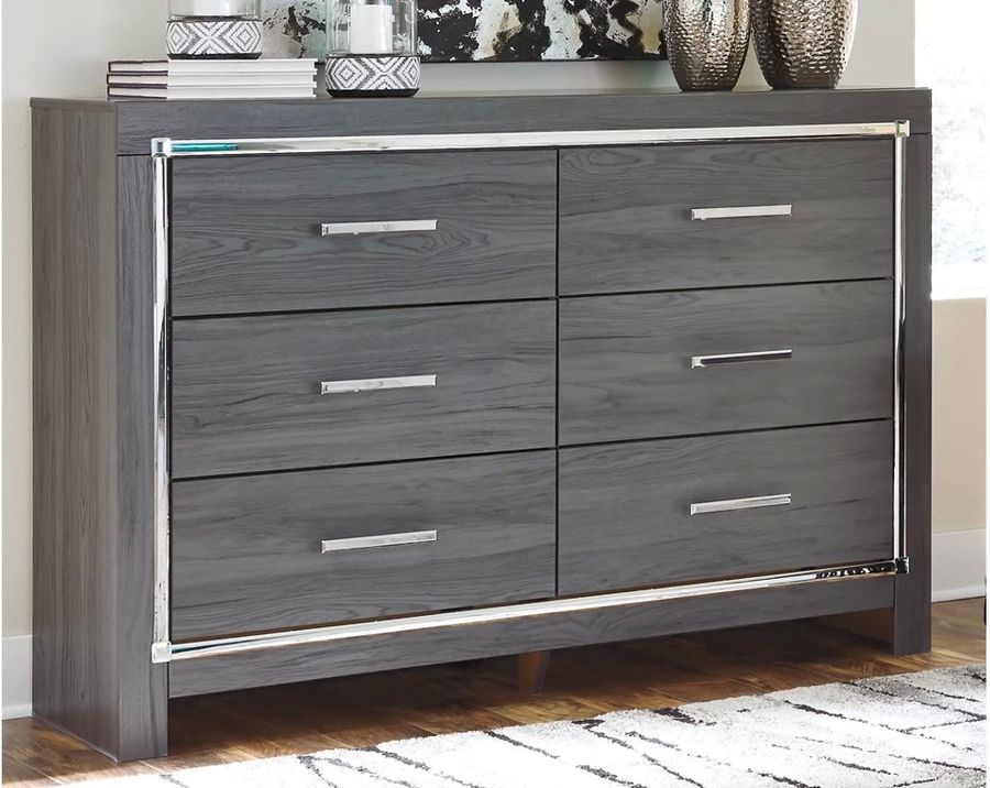 The appearance of Broad Marsh Gray Dresser designed by Boho House in the modern / contemporary interior design. This gray piece of furniture  was selected by 1StopBedrooms from Broad Marsh Collection to add a touch of cosiness and style into your home. Sku: B214-31. Material: Wood. Product Type: Dresser. Image1