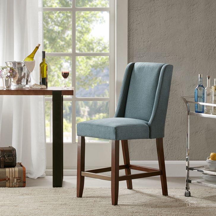 The appearance of Brody Wing Counter Stool In Blue designed by Olliix in the modern / contemporary interior design. This blue piece of furniture  was selected by 1StopBedrooms from Brody Collection to add a touch of cosiness and style into your home. Sku: MP104-0041. Material: Wood. Product Type: Barstool. Image1