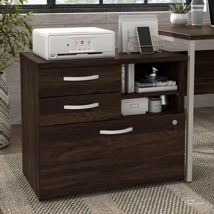 The appearance of Bush Business Furniture Hybrid Office Storage Cabinet with Drawers and Shelves in Black Walnut designed by Bush Furniture in the modern / contemporary interior design. This black walnut piece of furniture  was selected by 1StopBedrooms from Hybrid Collection to add a touch of cosiness and style into your home. Sku: HYF130BWSU-Z. Material: Wood. Product Type: Storage Cabinet. Image1