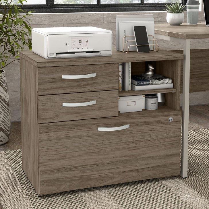 The appearance of Bush Business Furniture Hybrid Office Storage Cabinet with Drawers and Shelves in Modern Hickory designed by Bush Furniture in the modern / contemporary interior design. This hickory piece of furniture  was selected by 1StopBedrooms from Hybrid Collection to add a touch of cosiness and style into your home. Sku: HYF130MHSU-Z. Material: Wood. Product Type: Storage Cabinet. Image1