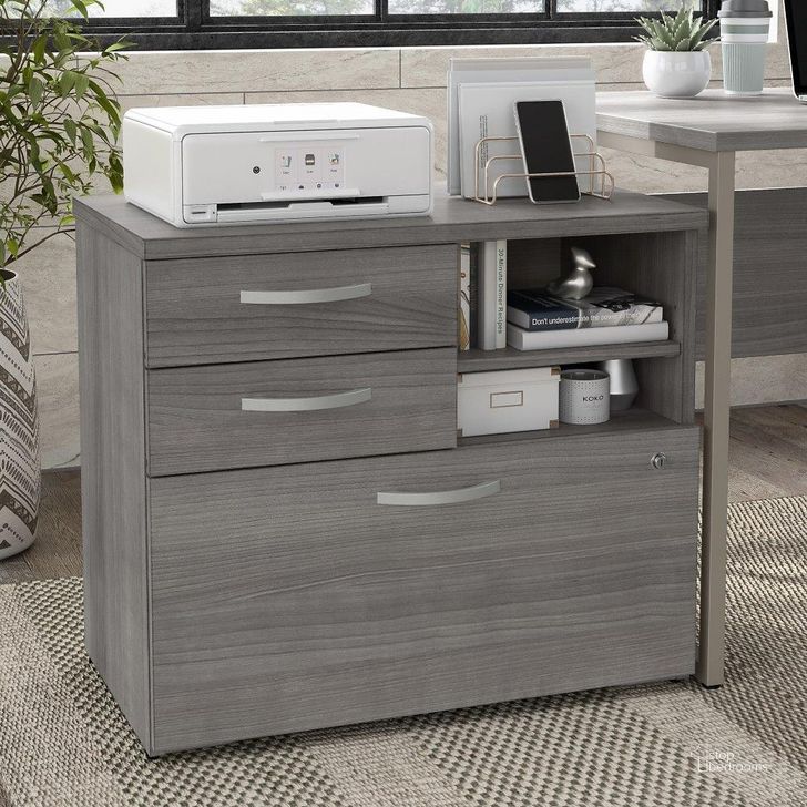 The appearance of Bush Business Furniture Hybrid Office Storage Cabinet with Drawers and Shelves in Platinum Gray designed by Bush Furniture in the modern / contemporary interior design. This gray piece of furniture  was selected by 1StopBedrooms from Hybrid Collection to add a touch of cosiness and style into your home. Sku: HYF130PGSU-Z. Material: Wood. Product Type: Storage Cabinet. Image1