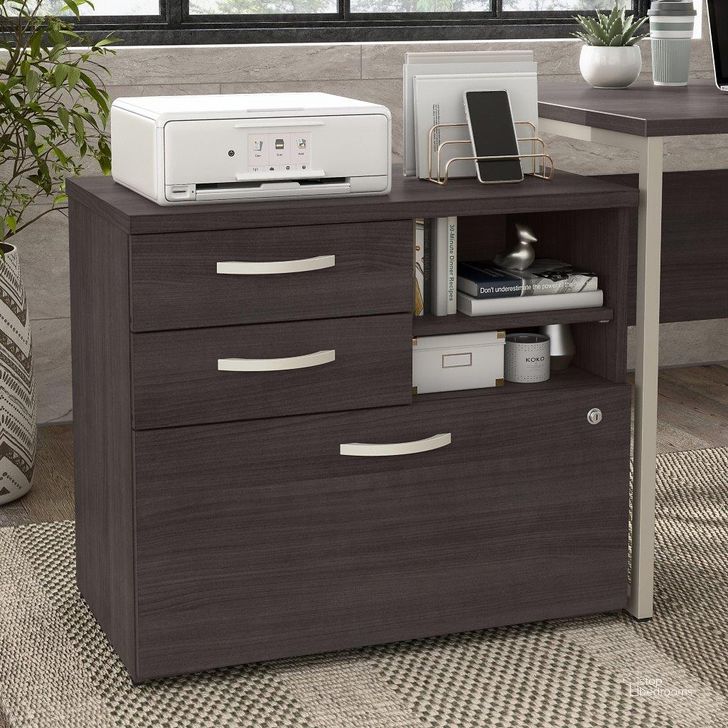 The appearance of Bush Business Furniture Hybrid Office Storage Cabinet with Drawers and Shelves in Storm Gray designed by Bush Furniture in the modern / contemporary interior design. This dark gray piece of furniture  was selected by 1StopBedrooms from Hybrid Collection to add a touch of cosiness and style into your home. Sku: HYF130SGSU-Z. Material: Wood. Product Type: Storage Cabinet. Image1