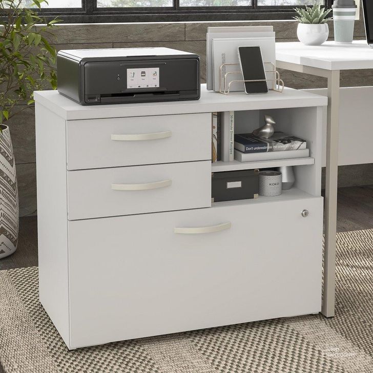 The appearance of Bush Business Furniture Hybrid Office Storage Cabinet with Drawers and Shelves in White designed by Bush Furniture in the modern / contemporary interior design. This white piece of furniture  was selected by 1StopBedrooms from Hybrid Collection to add a touch of cosiness and style into your home. Sku: HYF130WHSU-Z. Material: Wood. Product Type: Storage Cabinet. Image1