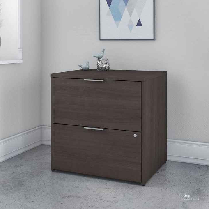 The appearance of Bush Business Furniture Jamestown 2 Drawer Lateral File Cabinet in Storm Gray designed by Bush Furniture in the modern / contemporary interior design. This gray piece of furniture  was selected by 1StopBedrooms from Jamestown Collection to add a touch of cosiness and style into your home. Sku: JTF130SGSU. Material: Wood. Product Type: Lateral Filing Cabinet. Image1