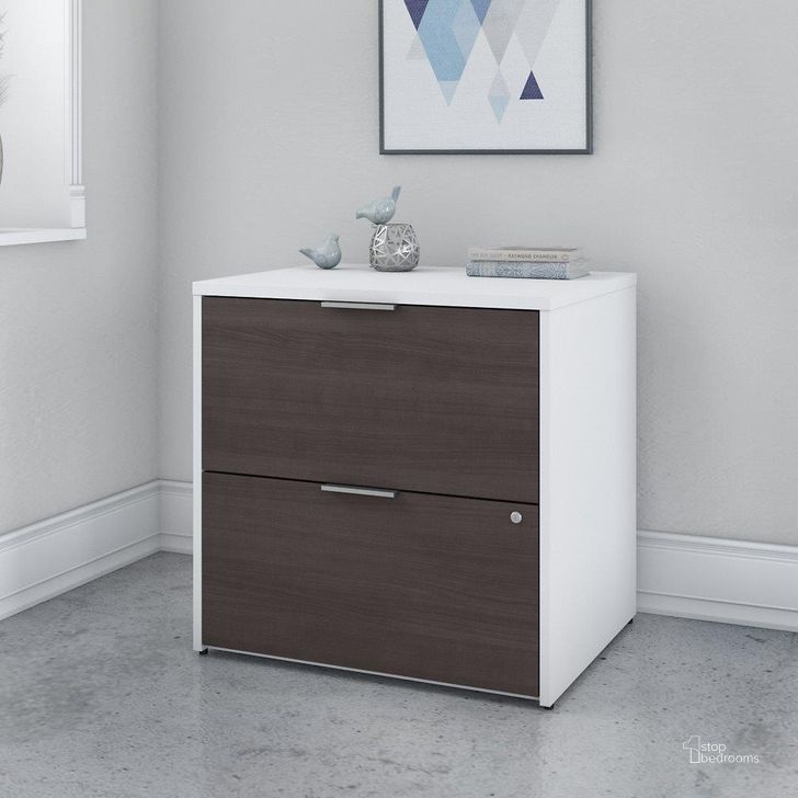 The appearance of Bush Business Furniture Jamestown 2 Drawer Lateral File Cabinet in White and Storm Gray designed by Bush Furniture in the modern / contemporary interior design. This gray and white piece of furniture  was selected by 1StopBedrooms from Jamestown Collection to add a touch of cosiness and style into your home. Sku: JTF130SGWHSU. Material: Wood. Product Type: Lateral Filing Cabinet. Image1