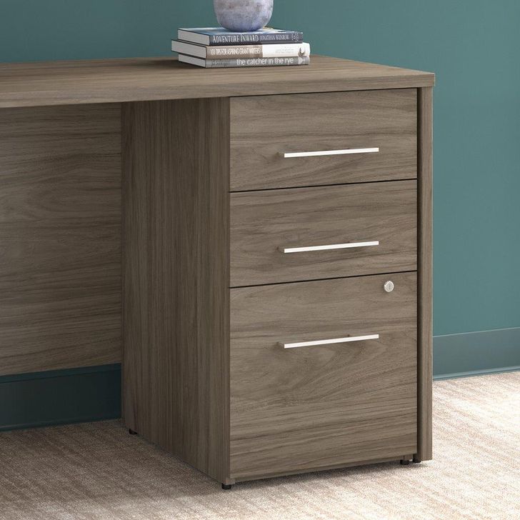 The appearance of Bush Business Furniture Office 500 16W 3 Drawer File Cabinet in Modern Hickory designed by Bush Furniture in the modern / contemporary interior design. This hickory piece of furniture  was selected by 1StopBedrooms from Office 500 Collection to add a touch of cosiness and style into your home. Sku: OFF116MHSU. Product Type: File Cabinet. Image1