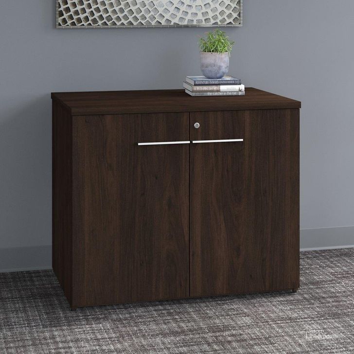 The appearance of Bush Business Furniture Office 500 36W Storage Cabinet with Doors in Black Walnut designed by Bush Furniture in the modern / contemporary interior design. This black walnut piece of furniture  was selected by 1StopBedrooms from Office 500 Collection to add a touch of cosiness and style into your home. Sku: OFS136BWSU. Product Type: Storage Cabinet. Image1