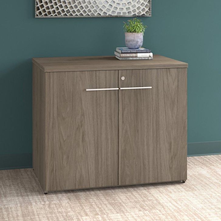 The appearance of Bush Business Furniture Office 500 36W Storage Cabinet with Doors in Modern Hickory designed by Bush Furniture in the modern / contemporary interior design. This hickory piece of furniture  was selected by 1StopBedrooms from Office 500 Collection to add a touch of cosiness and style into your home. Sku: OFS136MHSU. Product Type: Storage Cabinet. Image1