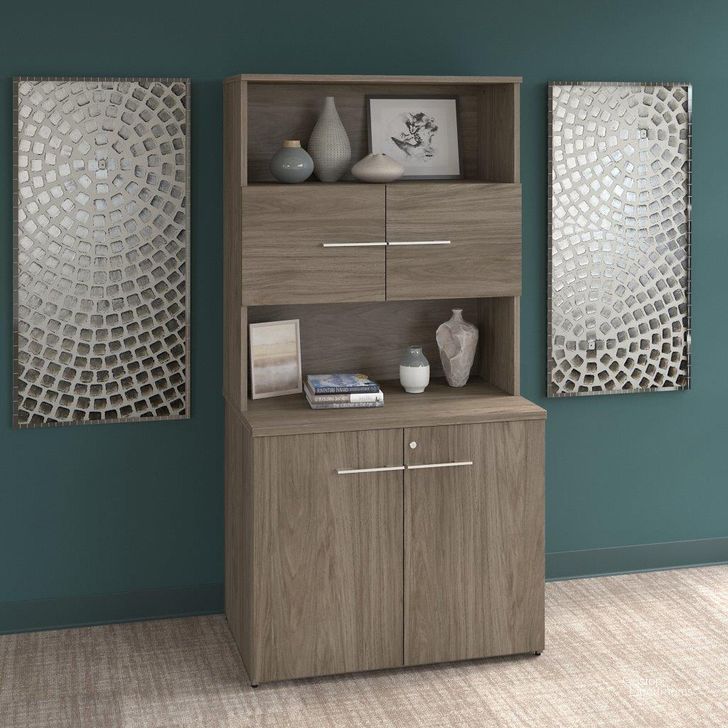 The appearance of Bush Business Furniture Office 500 36W Tall Storage Cabinet with Doors and Shelves in Modern Hickory designed by Bush Furniture in the modern / contemporary interior design. This hickory piece of furniture  was selected by 1StopBedrooms from Office 500 Collection to add a touch of cosiness and style into your home. Sku: OF5008MHSU. Product Type: Storage Cabinet. Image1