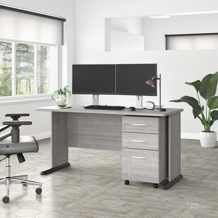 The appearance of Bush Business Furniture Studio A 60W Computer Desk with 3 Drawer Mobile File Cabinet in Platinum Gray designed by Bush Furniture in the transitional interior design. This gray piece of furniture  was selected by 1StopBedrooms from Studio A Collection to add a touch of cosiness and style into your home. Sku: STA002PGSU. Product Type: Computer Desk. Image1