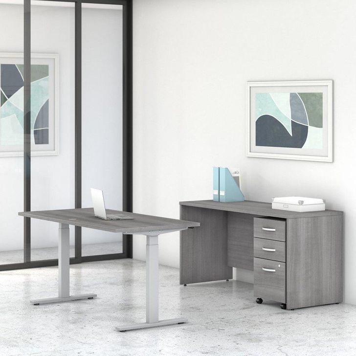 The appearance of Bush Business Furniture Studio C 60W x 30D Height Adjustable Standing Desk, Credenza and Mobile File Cabinet in Platinum Gray designed by Bush Furniture in the modern / contemporary interior design. This gray piece of furniture  was selected by 1StopBedrooms from Studio C Collection to add a touch of cosiness and style into your home. Sku: STC017PGSU. Product Type: Desk. Image1