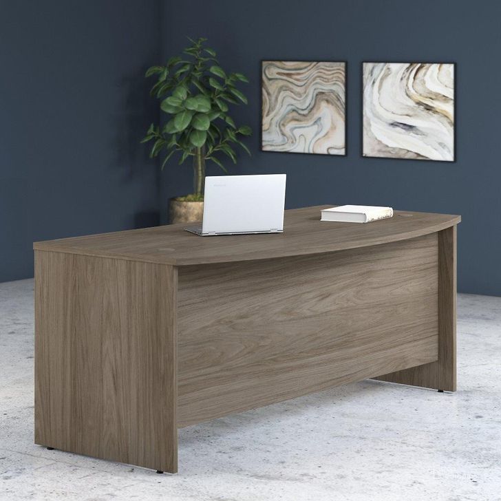 The appearance of Bush Business Furniture Studio C 72W x 36D Bow Front Desk in Modern Hickory designed by Bush Furniture in the modern / contemporary interior design. This hickory piece of furniture  was selected by 1StopBedrooms from Studio C Collection to add a touch of cosiness and style into your home. Sku: SCD172MH. Product Type: Desk. Image1