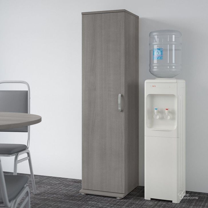 The appearance of Bush Business Furniture Universal Tall Narrow Storage Cabinet With Door And Shelves In Platinum Gray designed by Bush Furniture in the modern / contemporary interior design. This gray piece of furniture  was selected by 1StopBedrooms from Universal Collection to add a touch of cosiness and style into your home. Sku: UNS116PG. Product Type: Storage Cabinet. Image1