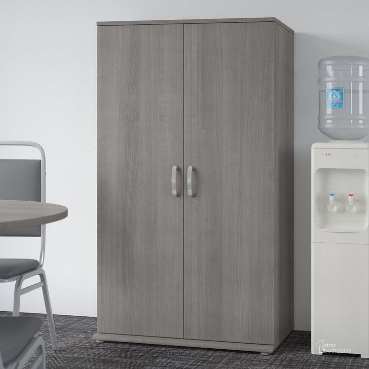 The appearance of Bush Business Furniture Universal Tall Storage Cabinet With Doors And Shelves In Platinum Gray designed by Bush Furniture in the modern / contemporary interior design. This gray piece of furniture  was selected by 1StopBedrooms from Universal Collection to add a touch of cosiness and style into your home. Sku: UNS136PGK. Product Type: Storage Cabinet. Image1