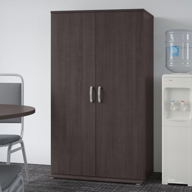 The appearance of Bush Business Furniture Universal Tall Storage Cabinet With Doors And Shelves In Storm Gray designed by Bush Furniture in the modern / contemporary interior design. This brown piece of furniture  was selected by 1StopBedrooms from Universal Collection to add a touch of cosiness and style into your home. Sku: UNS136SGK. Product Type: Storage Cabinet. Image1