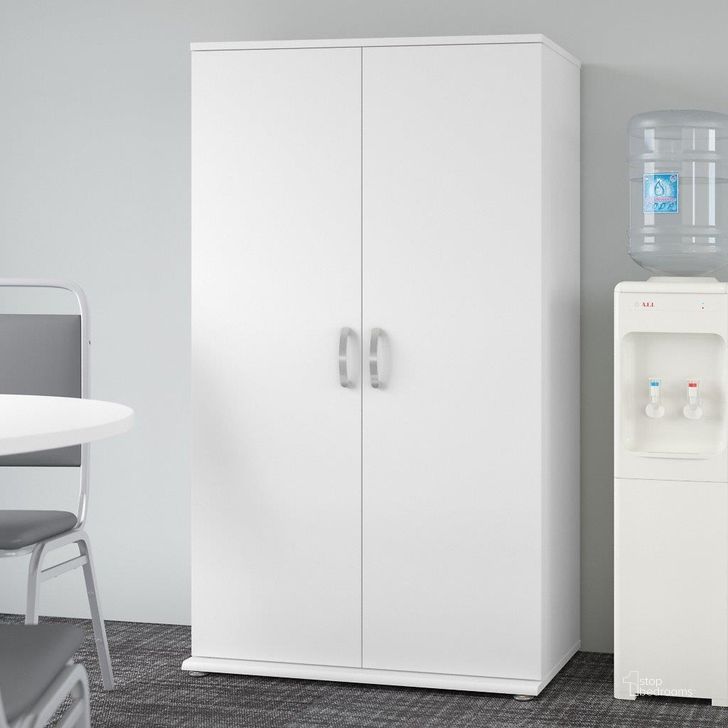 The appearance of Bush Business Furniture Universal Tall Storage Cabinet With Doors And Shelves In White designed by Bush Furniture in the modern / contemporary interior design. This white piece of furniture  was selected by 1StopBedrooms from Universal Collection to add a touch of cosiness and style into your home. Sku: UNS136WHK. Product Type: Storage Cabinet. Image1