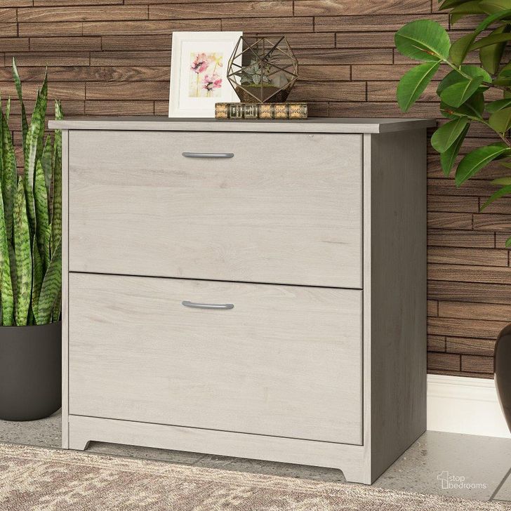 The appearance of Bush Furniture Cabot 2 Drawer Lateral File Cabinet in Linen White Oak designed by Bush Furniture in the modern / contemporary interior design. This oak and white piece of furniture  was selected by 1StopBedrooms from Cabot Collection to add a touch of cosiness and style into your home. Sku: WC31180-03. Product Type: Lateral Filing Cabinet. Image1