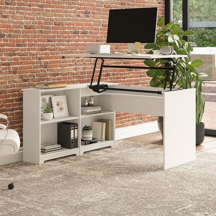 The appearance of Bush Furniture Cabot 52W 3 Position Sit To Stand Corner Desk with Shelves in White designed by Bush Furniture in the modern / contemporary interior design. This white piece of furniture  was selected by 1StopBedrooms from Cabot Collection to add a touch of cosiness and style into your home. Sku: WC31916. Product Type: Corner Desk. Image1