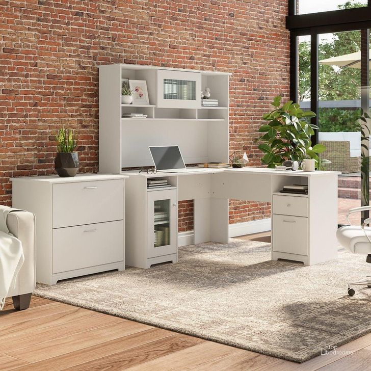The appearance of Bush Furniture Cabot 60W L Shaped Computer Desk with Hutch and Lateral File Cabinet in White designed by Bush Furniture in the modern / contemporary interior design. This white piece of furniture  was selected by 1StopBedrooms from Cabot Collection to add a touch of cosiness and style into your home. Sku: CAB005WHN. Material: Wood. Product Type: Computer Desk. Image1