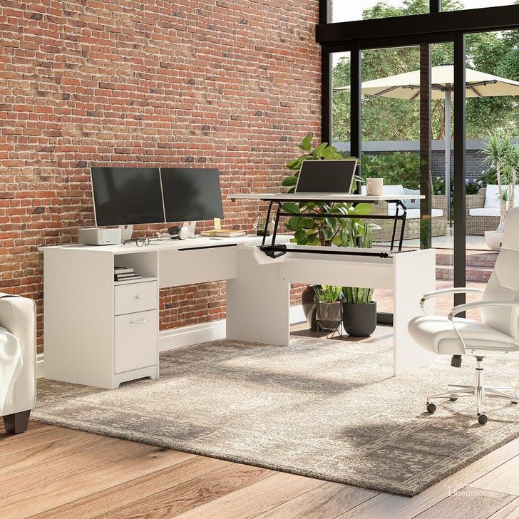 The appearance of Bush Furniture Cabot 72W 3 Position Sit To Stand L Shaped Desk in White designed by Bush Furniture in the modern / contemporary interior design. This white piece of furniture  was selected by 1StopBedrooms from Cabot Collection to add a touch of cosiness and style into your home. Sku: CAB050WHN. Material: Wood. Product Type: Desk. Image1