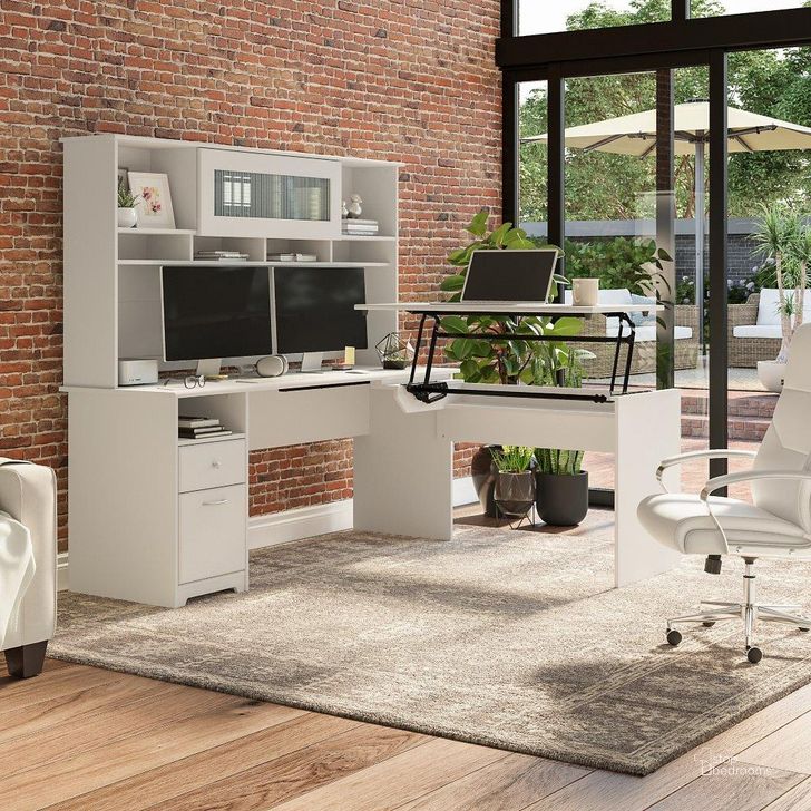 The appearance of Bush Furniture Cabot 72W 3 Position Sit To Stand L Shaped Desk with Hutch in White designed by Bush Furniture in the modern / contemporary interior design. This white piece of furniture  was selected by 1StopBedrooms from Cabot Collection to add a touch of cosiness and style into your home. Sku: CAB052WHN. Material: Wood. Product Type: Desk & Hutch. Image1