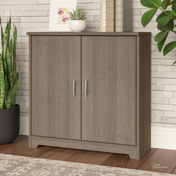 The appearance of Bush Furniture Cabot Small Storage Cabinet with Doors in Ash Gray designed by Bush Furniture in the modern / contemporary interior design. This ash gray piece of furniture  was selected by 1StopBedrooms from Cabot Collection to add a touch of cosiness and style into your home. Sku: WC31298. Product Type: Storage Cabinet. Image1