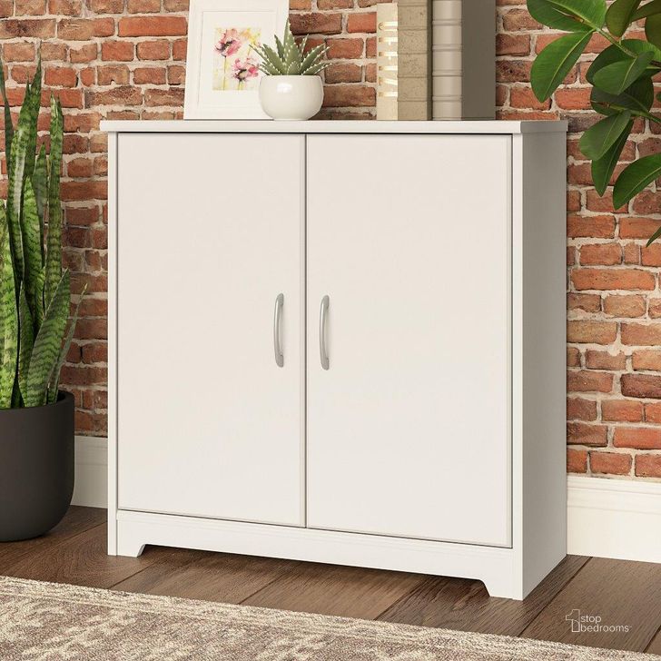 The appearance of Bush Furniture Cabot Small Storage Cabinet with Doors in White designed by Bush Furniture in the modern / contemporary interior design. This white piece of furniture  was selected by 1StopBedrooms from Cabot Collection to add a touch of cosiness and style into your home. Sku: WC31998. Product Type: Storage Cabinet. Image1